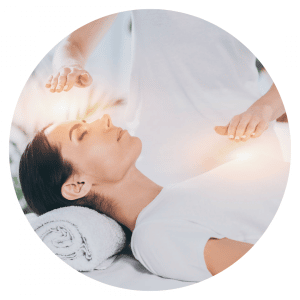 Woman receiving the healing reiki therapy
